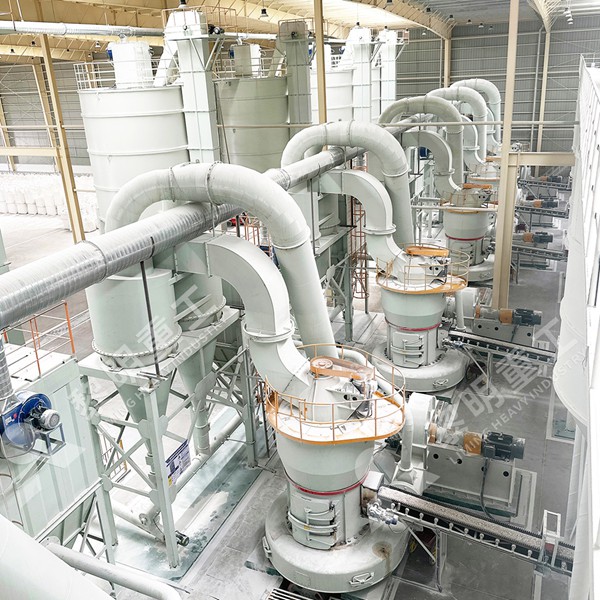 A complete calcite grinding production line from Liming Heavy Industry, showing crusher, feeder, grinding mill, and dust collection system in an industrial setting.