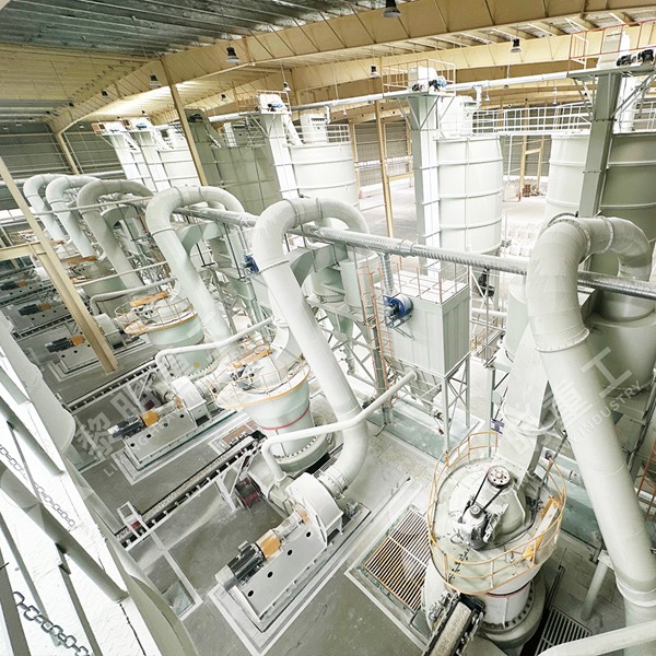 Close-up view of a LIMING MTW European Mill being adjusted during commissioning phase in an industrial plant