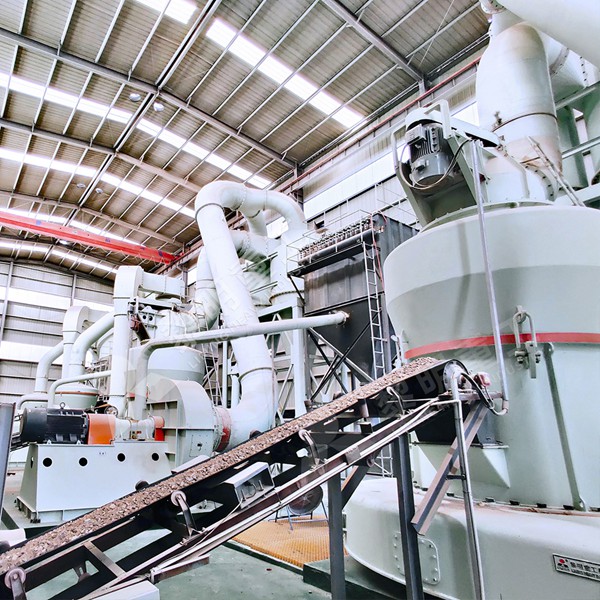 Finished crushed limestone powder being automatically bagged in a clean, modern factory setting.