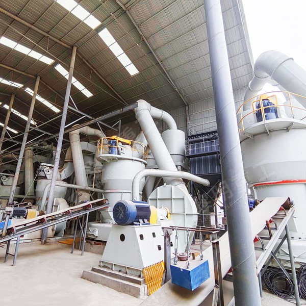 Close-up view of kaolin clay being evenly fed into the hopper of a Liming Raymond Mill