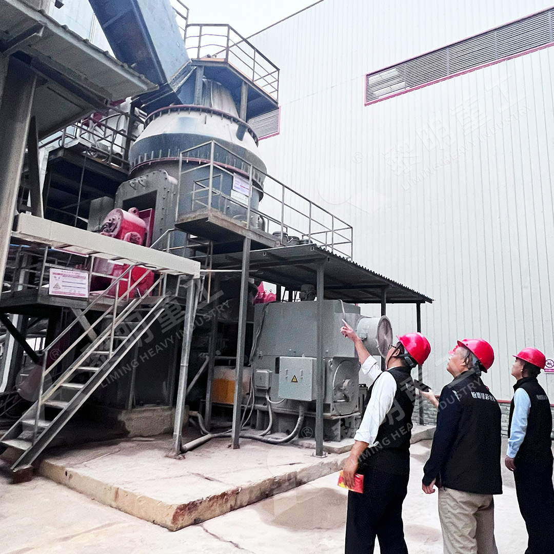 Marble roller mill in operation for putty powder grinding, showing roller assembly and grinding table
